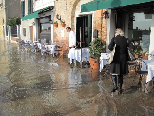 woman walking on a flooded sidewalk