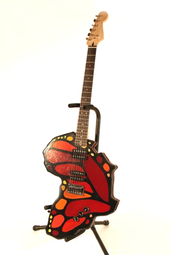 red electric guitar with the shape of a butterfly's wing