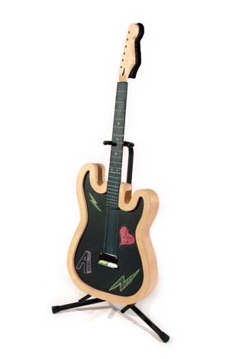 a small electric guitar with a wooden frame and a black portion colored with chalk