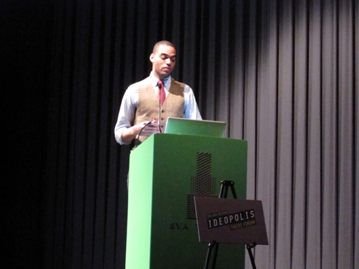 a man in a suit giving a speech in the Ideopolis exhibition