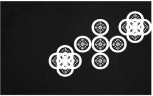 an arrangement with white circles and patterns in them on a black background