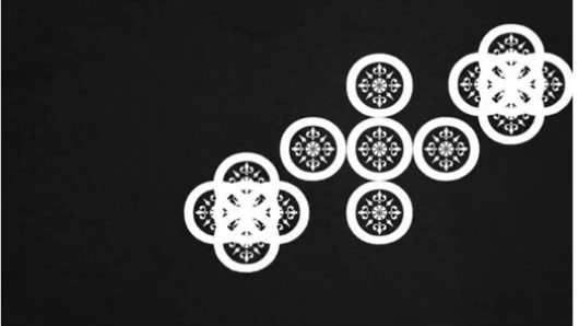 an arrangement with white circles and patterns in them on a black background