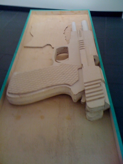 wooden sculpture of a gun