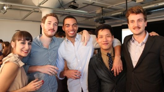 a group photo of students, four men and one woman