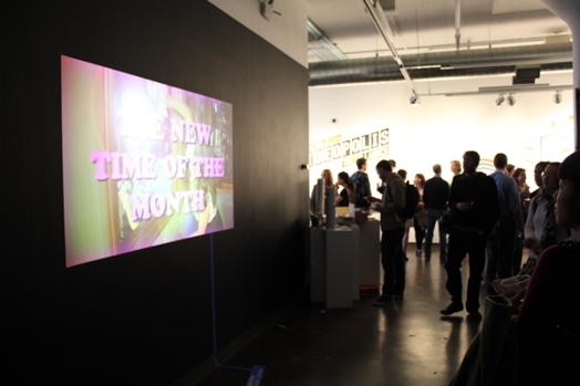overview of a video presentation projected on a wall in the exhibition room