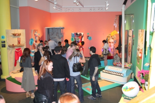 overview of the exhibition with people looking around