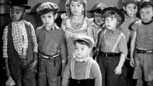 still from an old movie in black and white with a group of children