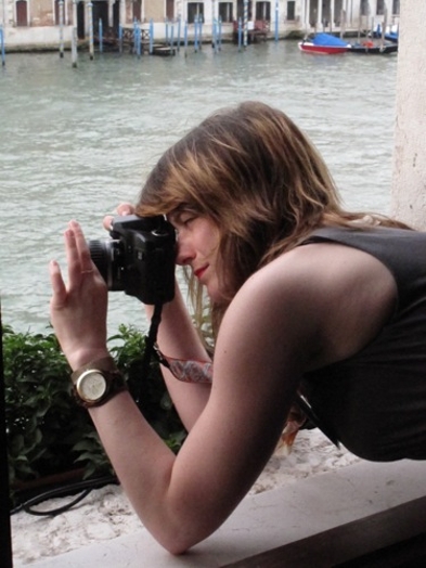 a woman taking photos with a camera