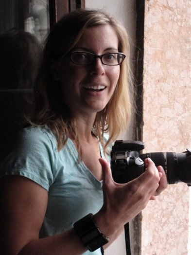 a women holding a camera