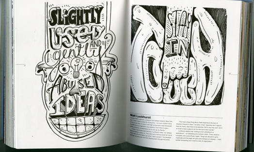 an opened book depicting black and white typography illustration