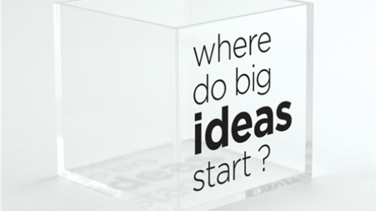 a transparent cube recipient with the text where do big ideas start?