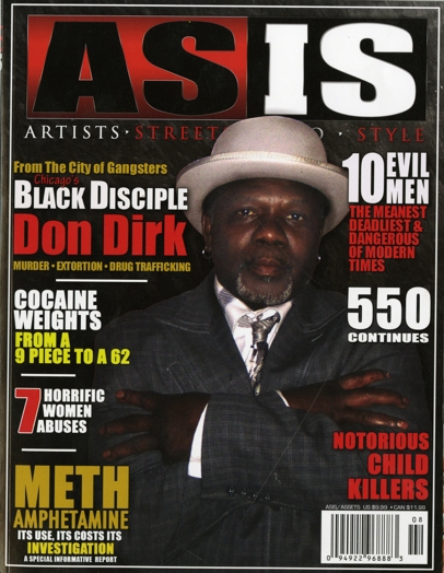 as is magazine cover with a man in a suit and a grey hat