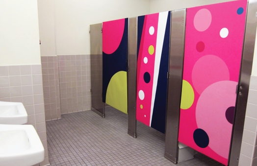 pink colorful bathroom doors with big white, yellow and black dots
