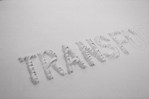 typography project made with thin pieces of paper cuts as the contour of the letters