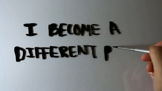 "i become a different person everyday" message written by a person on a reflective surface.