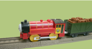a small 3d plastic train locomotive and a wagon
