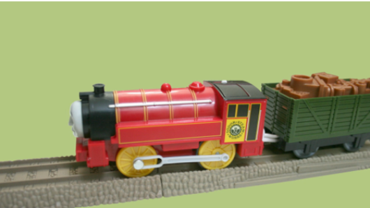 a small 3d plastic train locomotive and a wagon