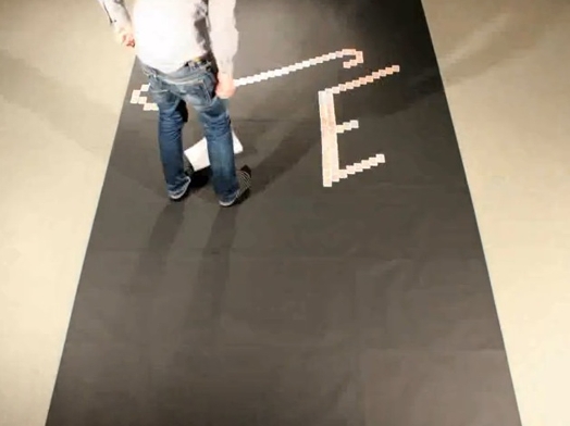 a man working on a large banner