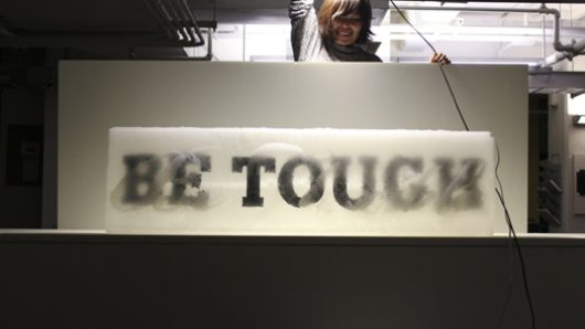 be touch banner and a person orienting a light above it