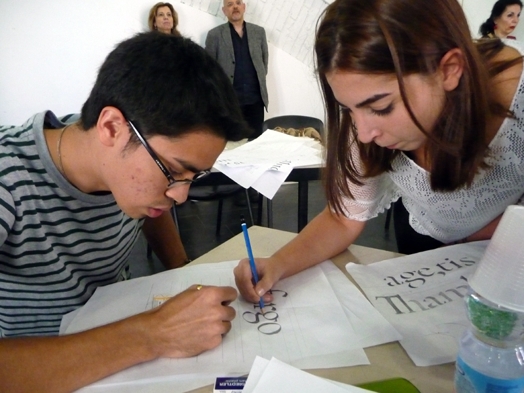 two students drawing type