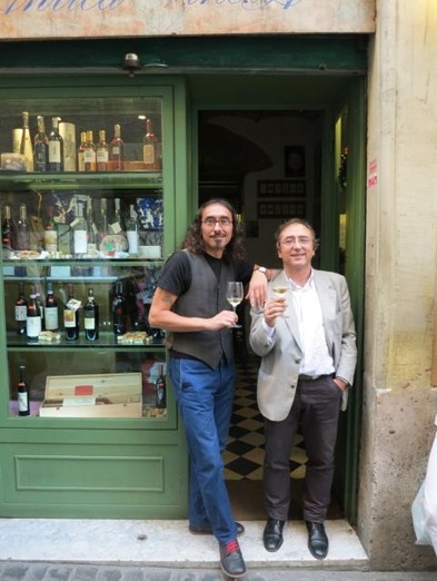 two men drinking at door