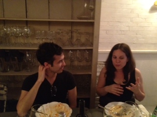 man and woman talking at the restaurant