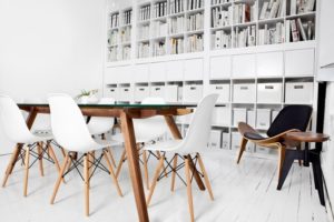 white room with desk and chairs