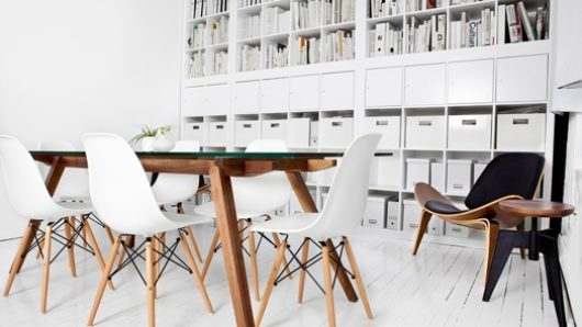 white room with desk and chairs