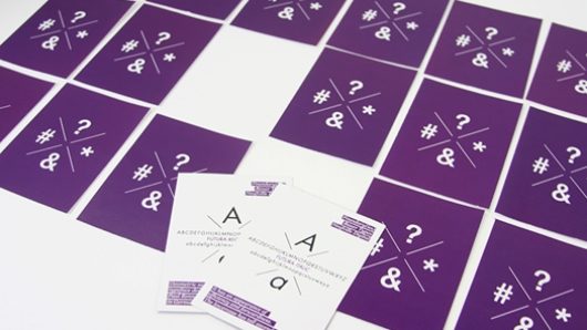 surprise cards with a purple back and two are turned over to reveal a white side and A letter with some text below it