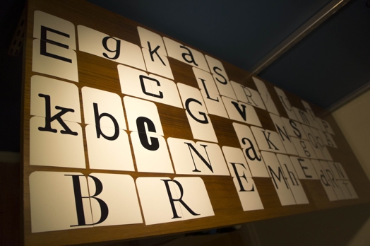 A photo of a set of tiles, each pair making a letter of the alphabet.