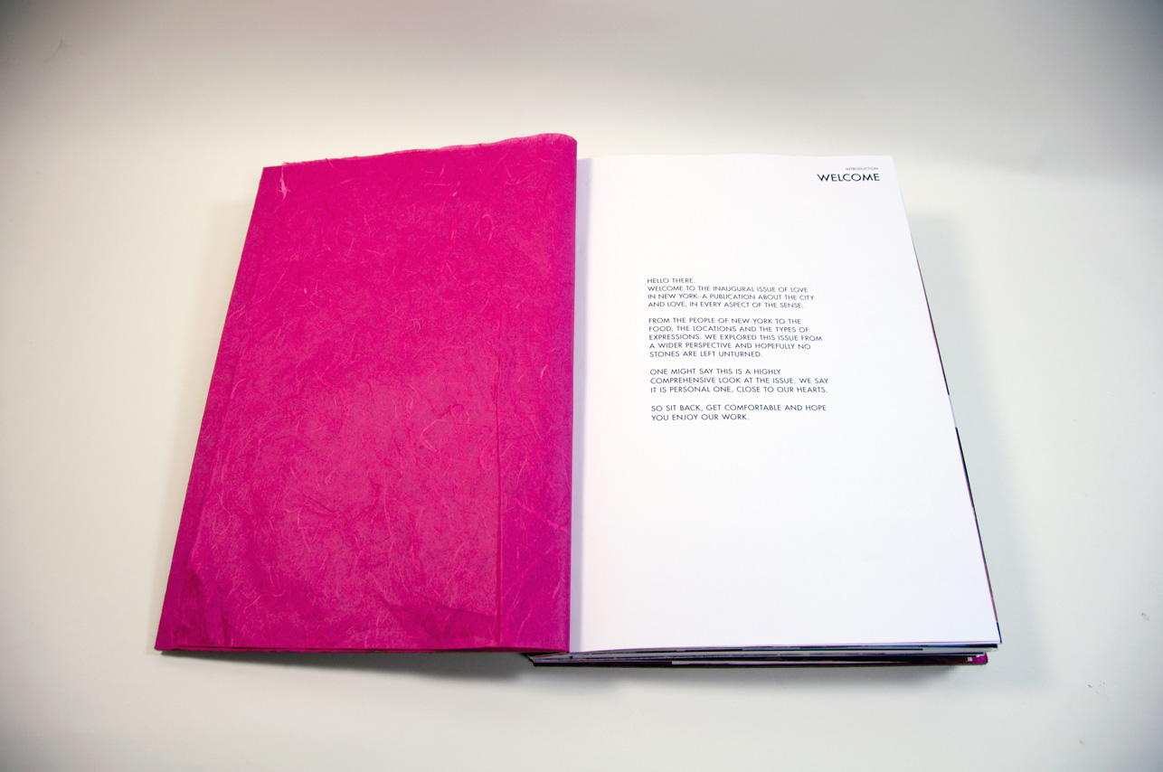 an opened book with a pink page on the left and four text paragraphs on the right page