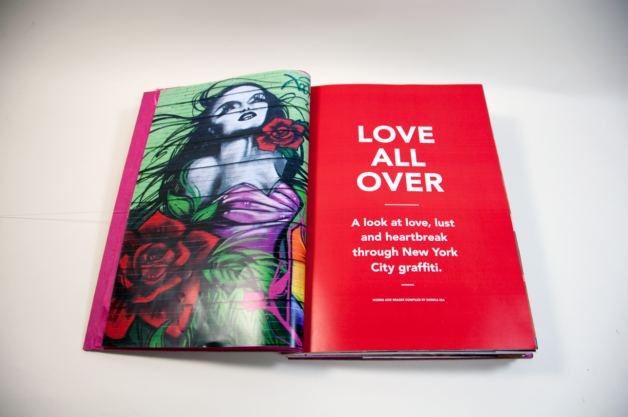 An opened book depicting a woman tattoo and roses on the left page and typography design on the right: love all over. a look at love, lust, and heartbreak through new york city graffiti.