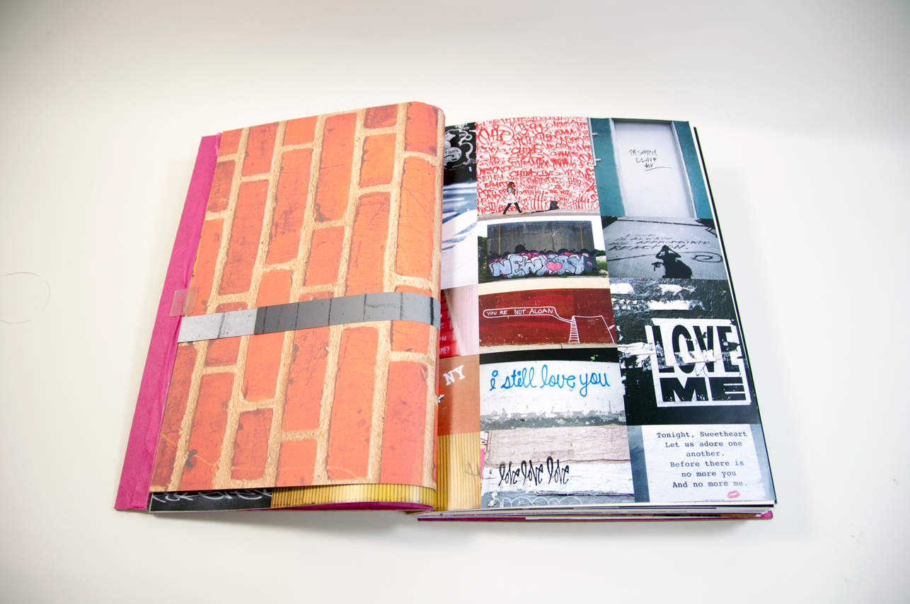 an opened book depicting a brick wall on the left and a collage of random images on the right