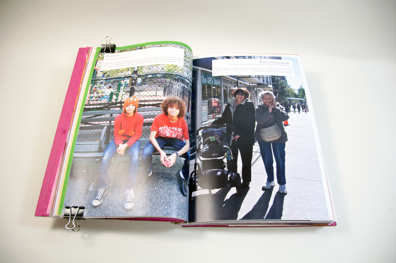 an opened book depicting on the left side a picture of two kids with orange t-shirts sitting on a bench and on the right side two older women with a baby stroller on the sidewalk