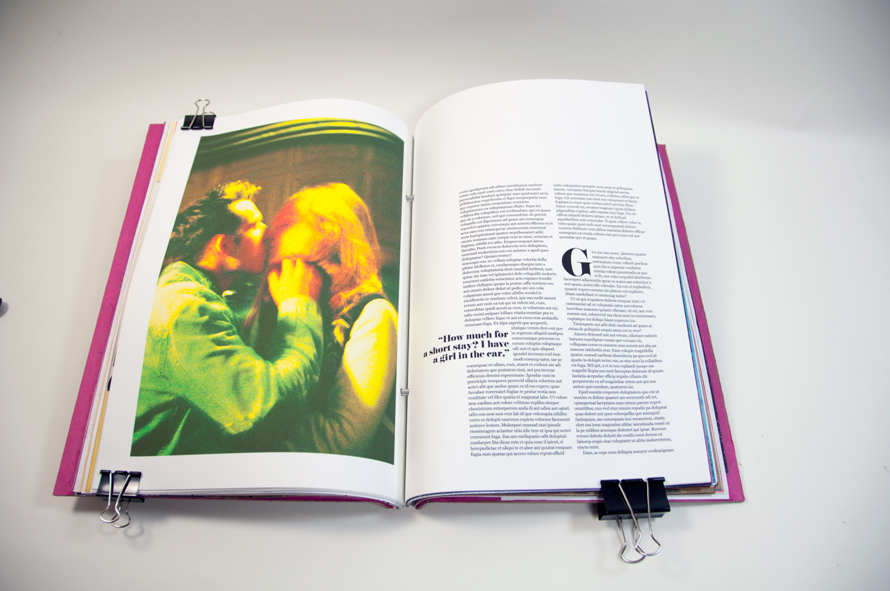 an opened book with an image of two people kissing on the left, and on the right are several text paragraphs