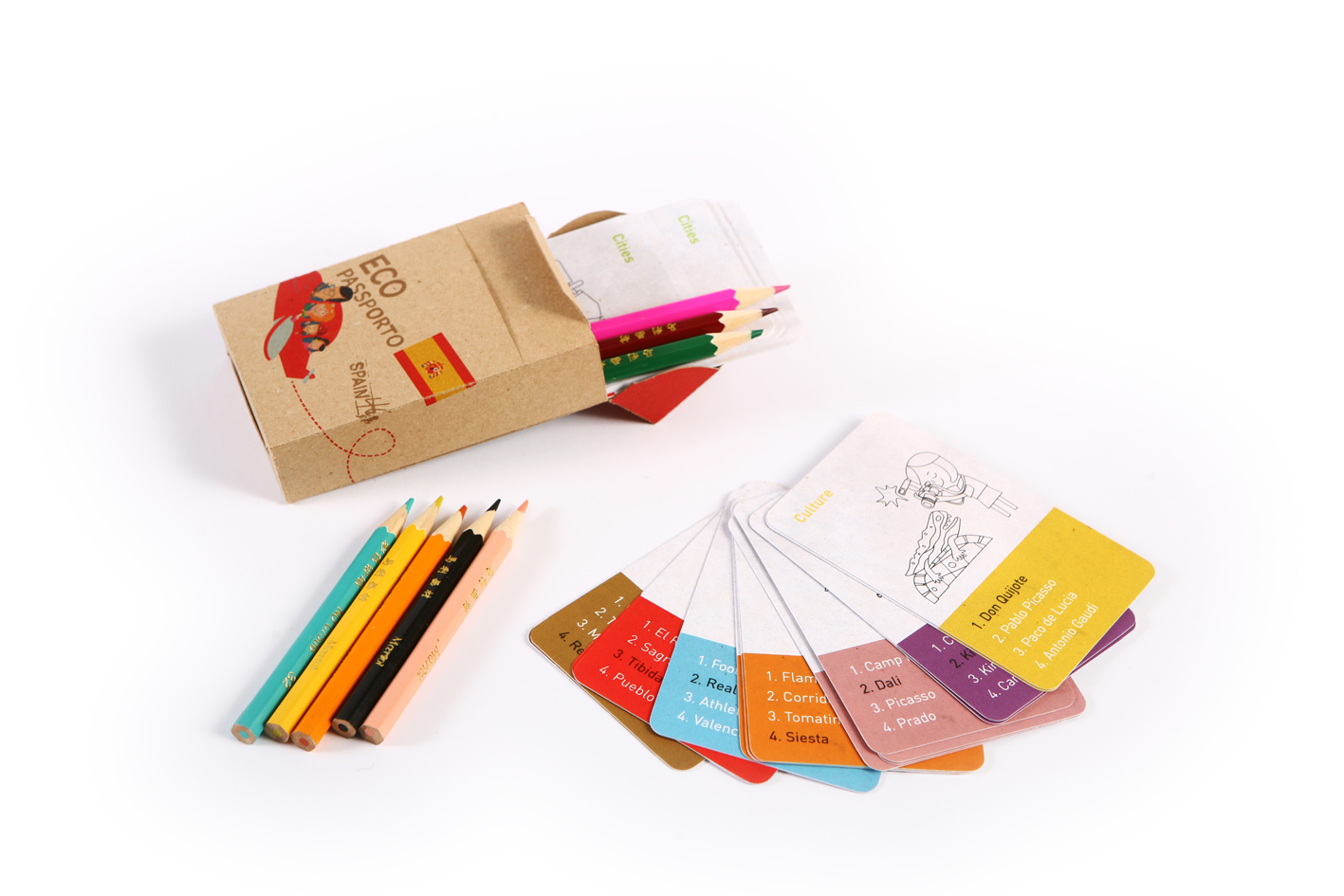 Coloring pencils and small cards with shapes to color and small portions of text on orange, blue, pink, etc.