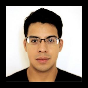 A photo of a man wearing glasses and a black shirt.