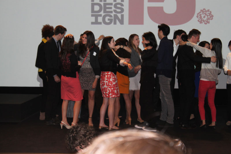students hugging and congratulating each other