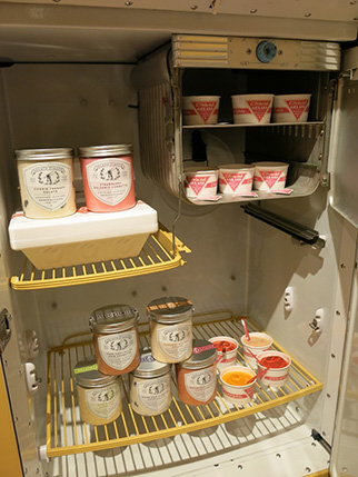 fridge shelves  with different cans and products