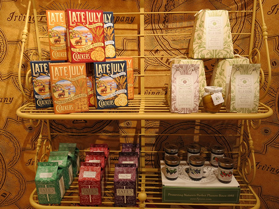 a shelf with cereals, tee bags, etc