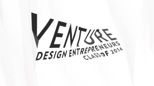 A photo of a white piece of clothing with text: Venture Design Entrepreneurs Class of 2014.