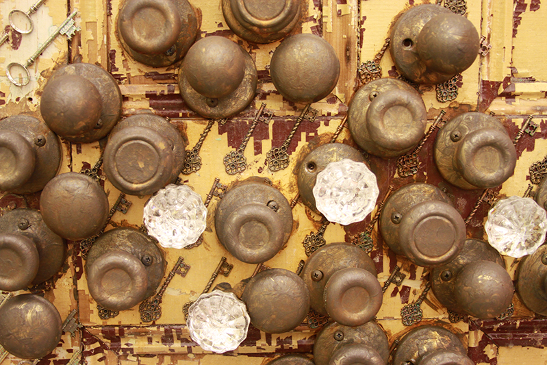 door knobs and keys on a surface