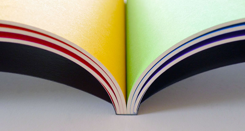 colored paper and lined paper book