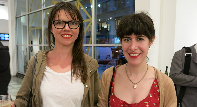 portrait of two woman, one dressed in red and one dressed in white