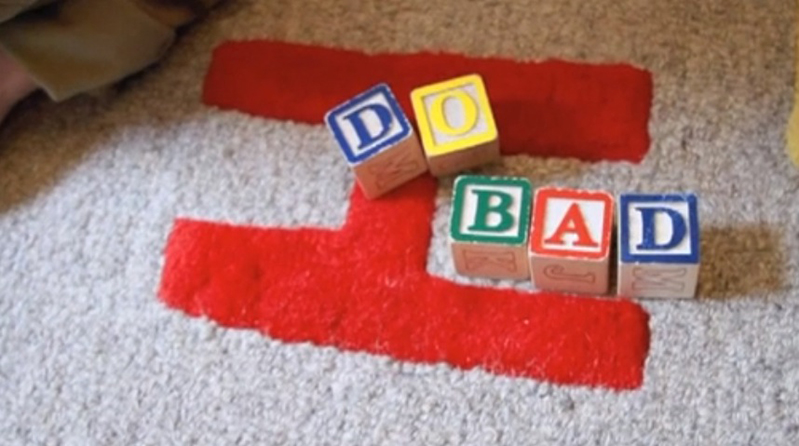 wooden block cube letters on rug