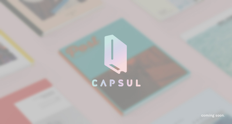 A n image of some isometric drawn colored papers, and over it a book logo with the text CAPSUL.