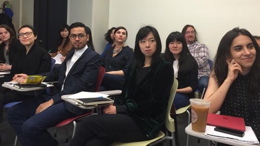 A photo of a group of students sitting in a class room.