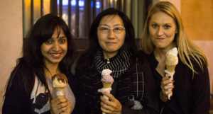 three women holding ice cream