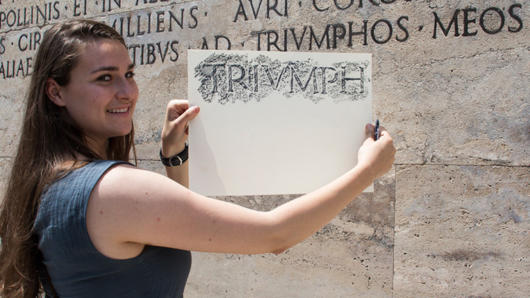 woman holding paper and pencil