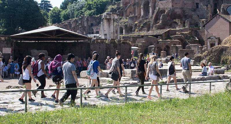 a group walking in ancient ruins